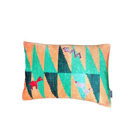 Front view of rectangular velvet cushion with geometric print and animal shapes in orange and green.