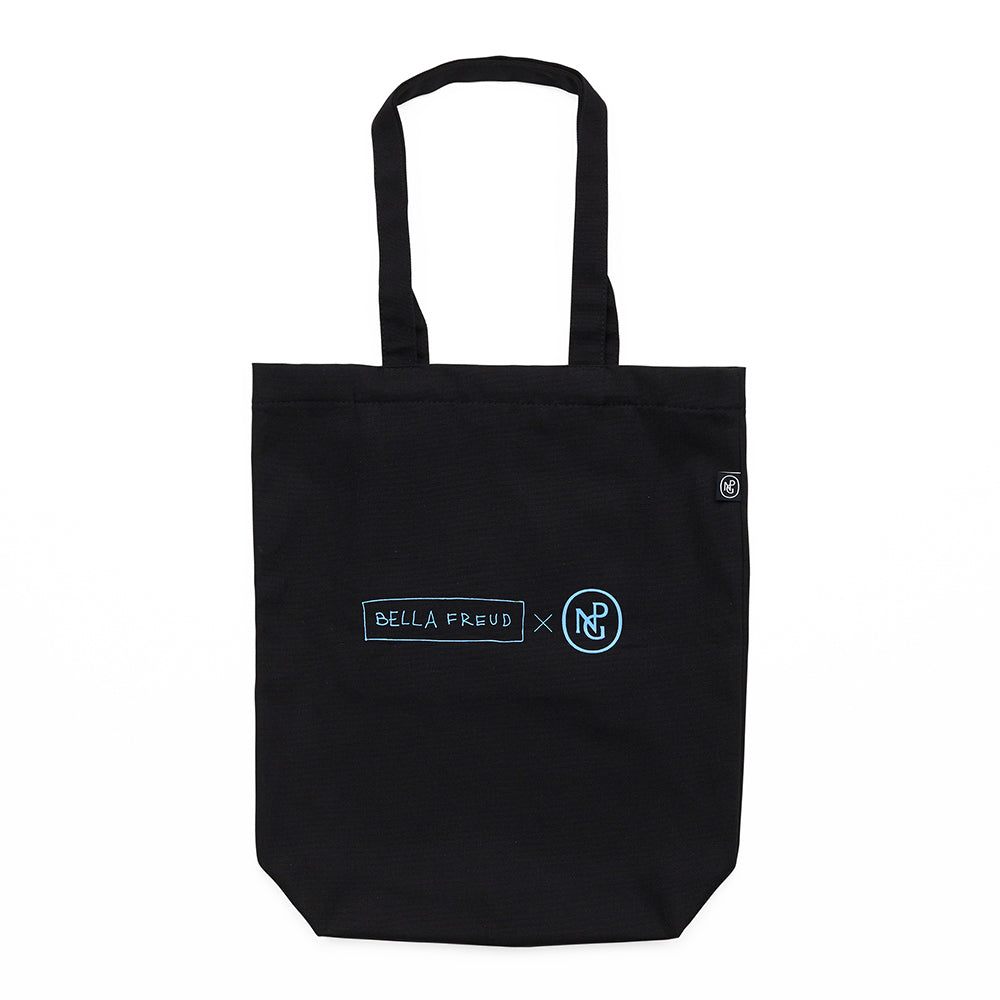Reverse of a black tote bag with the text 'bella freud x npg' in blue.