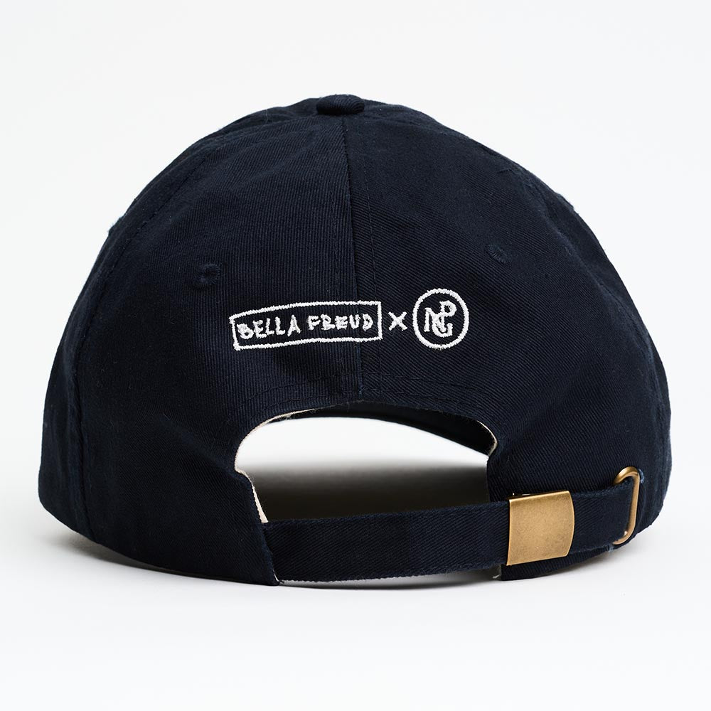Navy blue cap with metal clasp and embroidered bella freud x npg logo in white on a white background