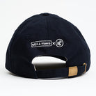 Navy blue cap with metal clasp and embroidered Bella Freud x NPG logo in white on a white background