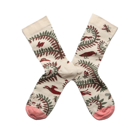 A pair of cream socks with floral bird pattern and contrasting pink toes. 