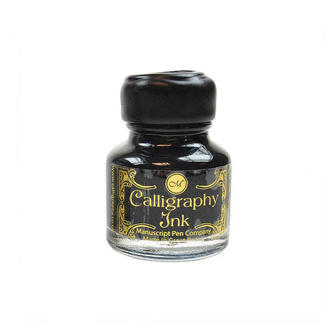 A small glass bottle with gold decorative 'calligraphy ink' label and black wax seal lid.