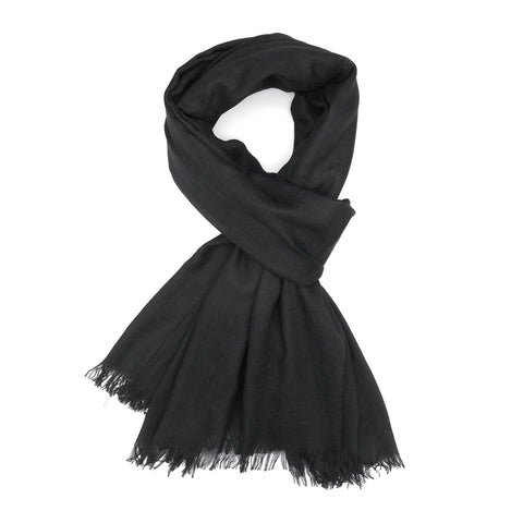 A plain black scarf tied in a styled knot.