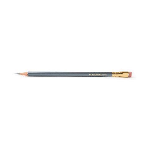 Blackwing 602 pencil in gunmetal colour finish with a pink eraser held by a gold metal casing.