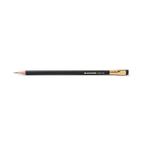 Blackwing matte black pencil with black eraser in a gold metal casing.