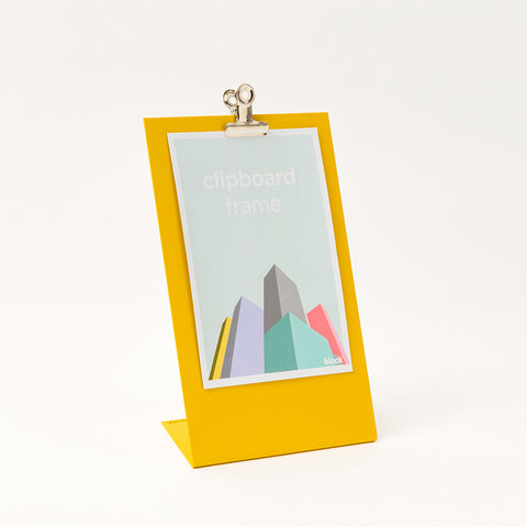 Self standing yellow clipboard frame.