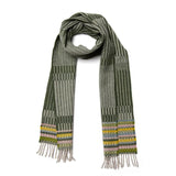 A multi-hued green scarf with hints of yellow and tassels at the bottom. 