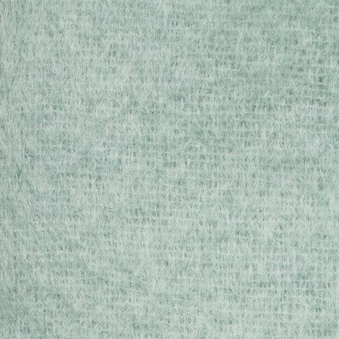 Close up of the light green wool scarf.