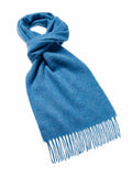 A blue wool scarf with tassels at the bottom.