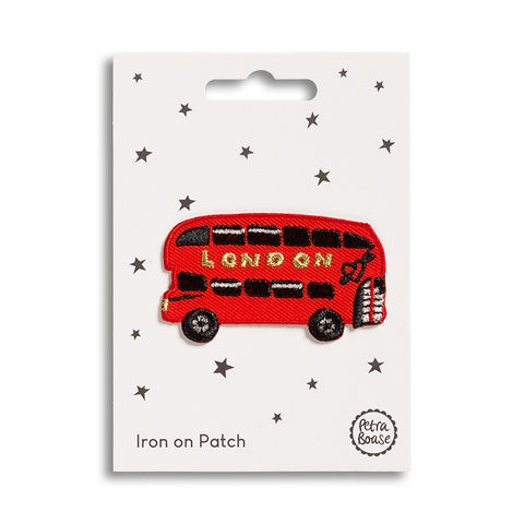 An iron on patch featuring a classic London red bus.