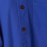 Close up of the brown buttons on the ultra blue buttoned overshirt.