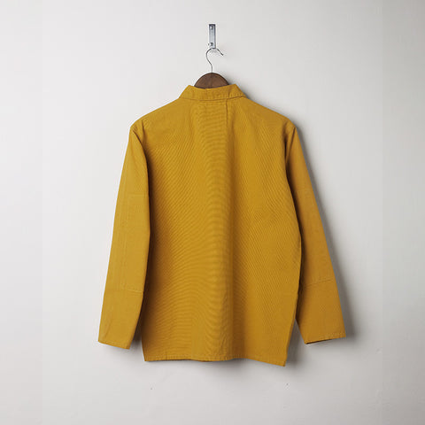 Back of the yellow buttoned overshirt.