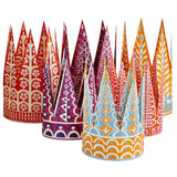 Six colourful, printed, paper Christmas crowns with tall peaks. 