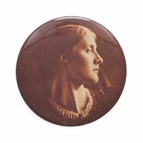 Circular pocket mirror featuring a sepia tone photograph of a woman in a pearl necklace. 