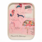 Decorative tray with illustrations of women's with floral headpieces on a pink background.