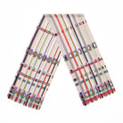 A multicoloured scarf with a geometric pattern of stripes and squares folded in a v shape.