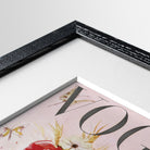 Framed Vogue magazine cover artwork with floral design in a black frame.