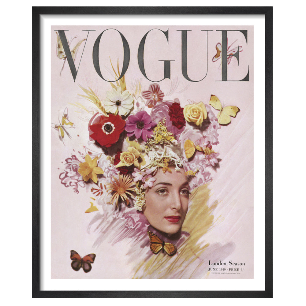 Framed photographic print of a vogue magazine cover with a woman adorned with flowers and butterflies