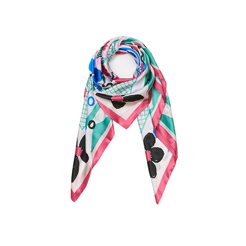 Styled square scarf with graphic floral print in pink, green, black and white.