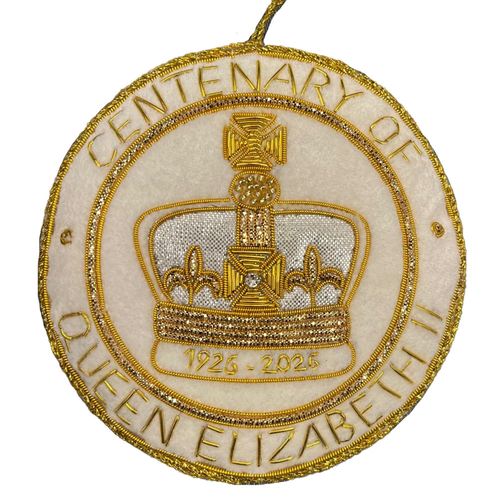 Round fabric decoration embroidered with a crown and the words 'centenary of elizabeth ii, 1926   2025' against a white background