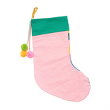 Reverse of stocking with a plain pink back and green top with hanging pom poms.