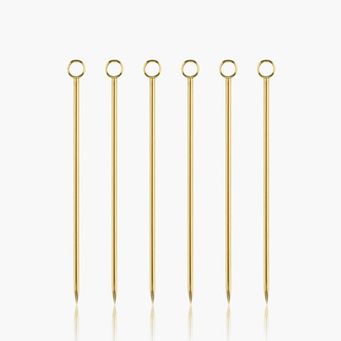 6 gold cocktail sticks for olives, oranges, etc. 