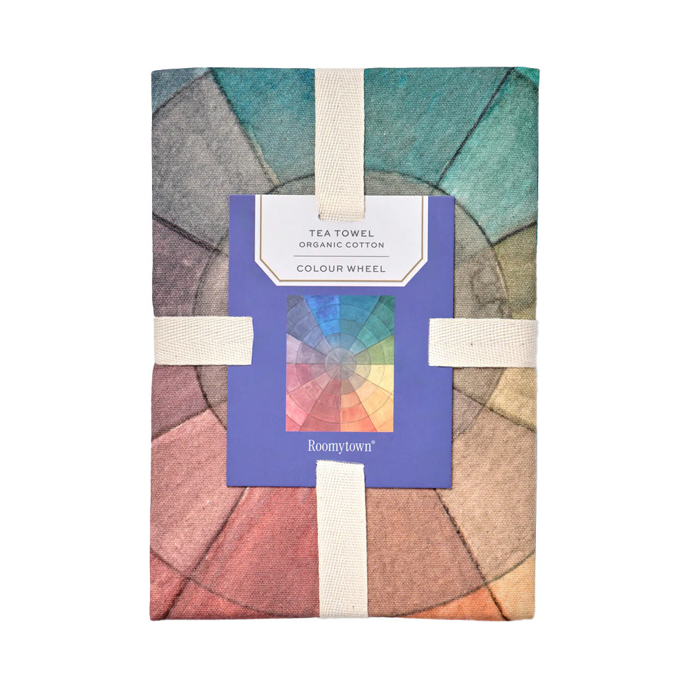 Tea towel with colour wheel design folded in roomytown branded packaging.