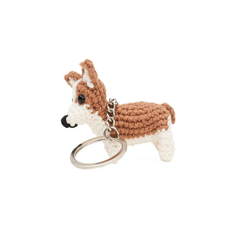 Crochet corgi dog on a keychain, side view.