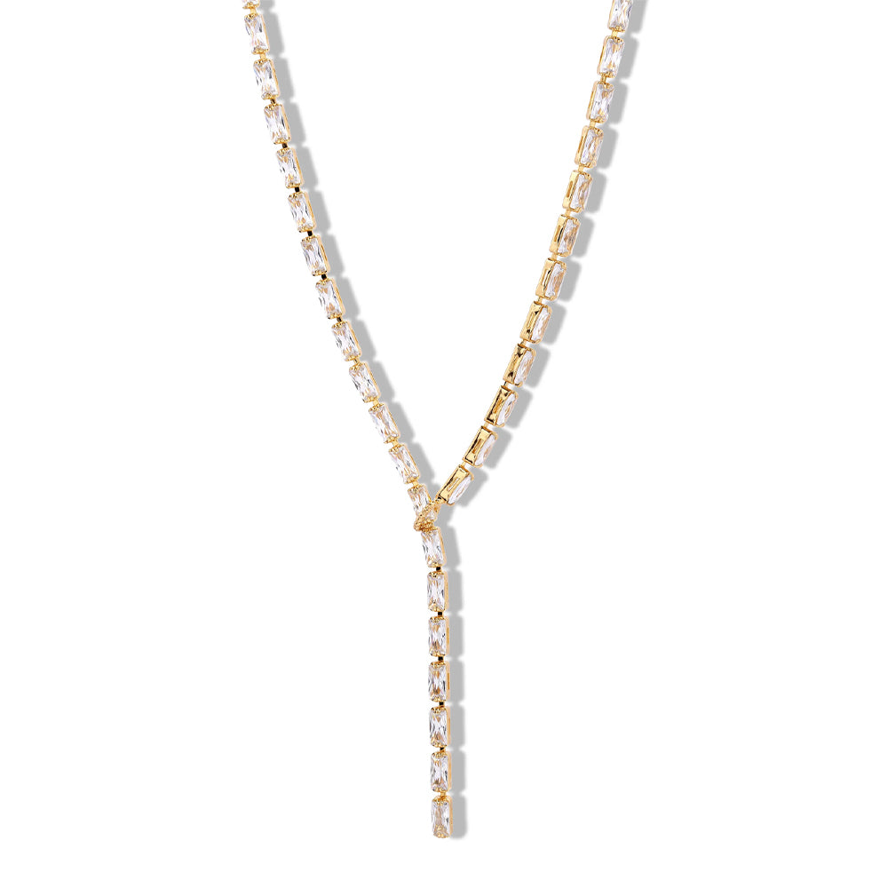 Gold necklace with clear crystal rectangular stones on a white background