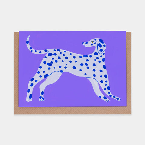 Grey and blue Dalmatian dog on a purple background. 
