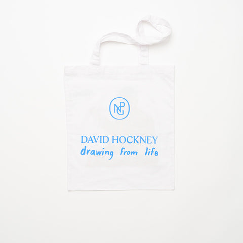 Back of white tote bag with "David Hockney, drawing from life" and the NPG logo in blue print.