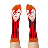 A pair of character socks with faces modelled on feet.