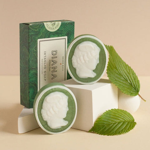 Set of two green oval soaps featuring a cameo in white of goddess Diana. 
