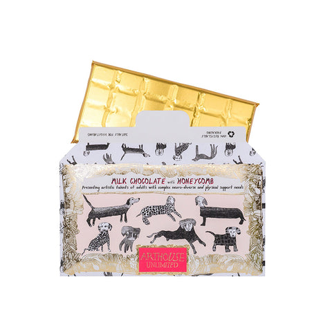 Rectangular chocolate bar with gold frame on outer packaging with dog sketch artwork.