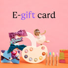 Colorful art supplies including bows, a palette, and crayons on a pink background with 'E-gift card' text.
