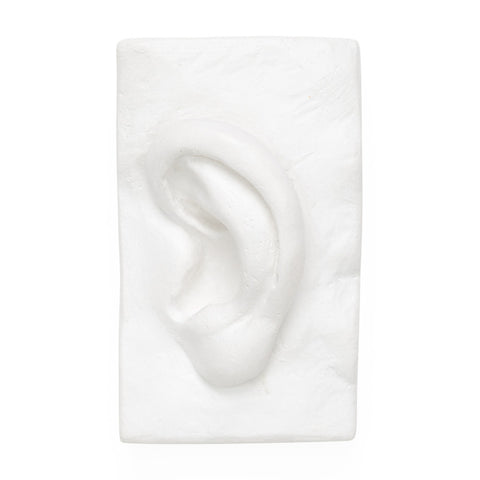 White 3D sculpture of a human ear.