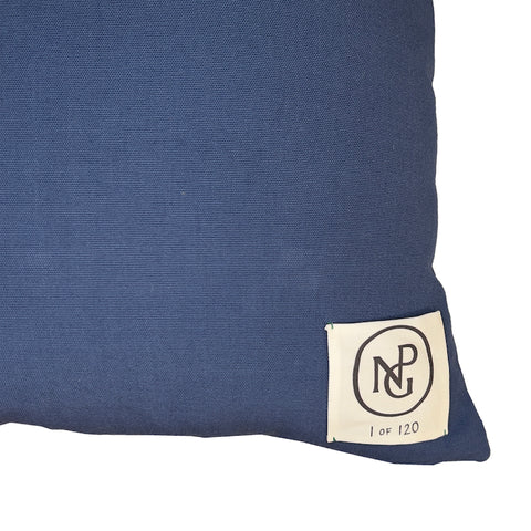 Close up of NPG logo on the back of the pillow cushion.