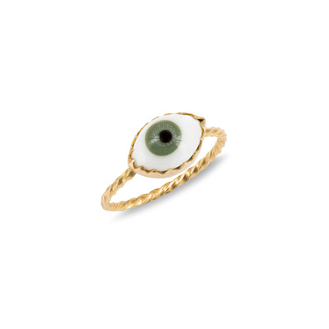 Green eye charm on a gold ring
