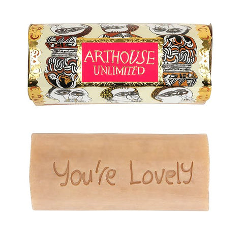 Tubular shaped soap carved with the words 'you're lovely' in gold packaging with figureheads design.
