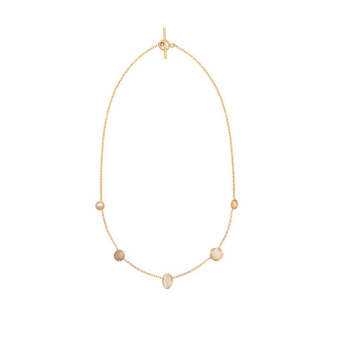 Five white opal and pearl charms on a gold chain necklace.