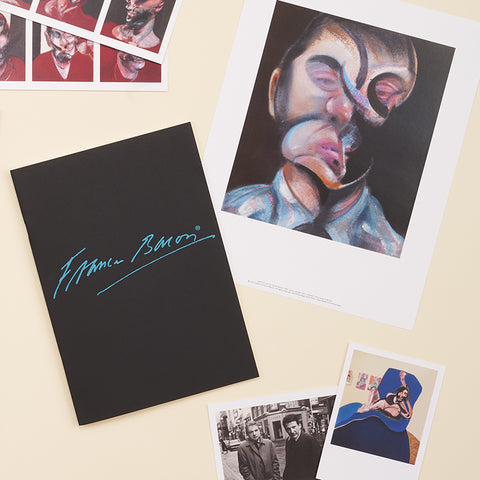 The front of the black sketchbook with several postcards of Francis Bacon's artworks, with the colourful abstract faces. 