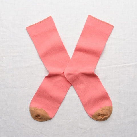 Bright pink socks with a khaki coloured toe.