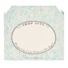 Reverse view of card with an oval area for writing inside and the words 'designed by Emily Sutton for Art Angels' at the bottom.