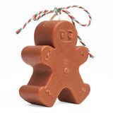 Dark brown gingerbread man candle, side view. 