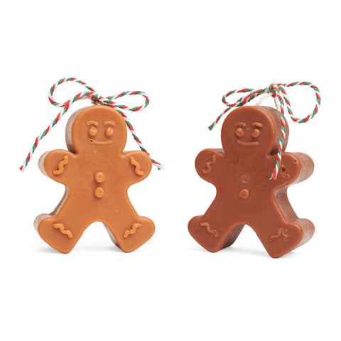 Dark brown and light brown gingerbread men side by side. 