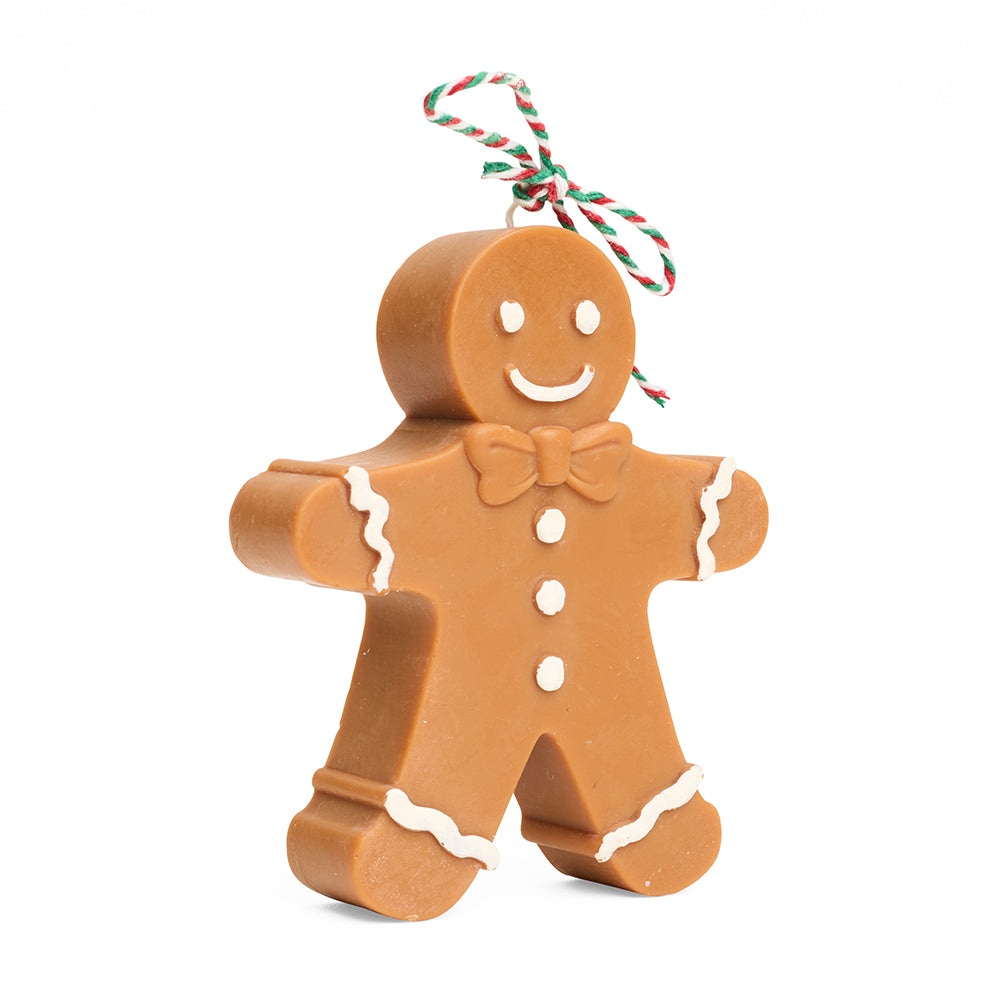 Gingerbread man 3d candle with a smiley face on a white background