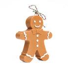 Gingerbread man 3D candle with a smiley face on a white background