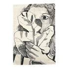 Tea towel with a black and white illustration of a face with a leaf over one eye and hands holding a leaf