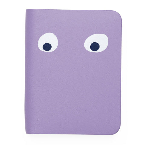 Purple mini notebook featuring printed googly eye design . 