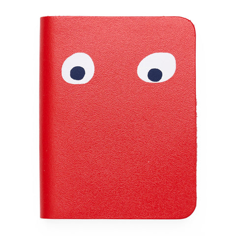 Red mini notebook featuring printed googly eye design . 